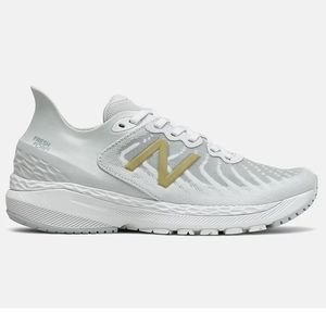 New Balance White and Gold Athletic Shoes